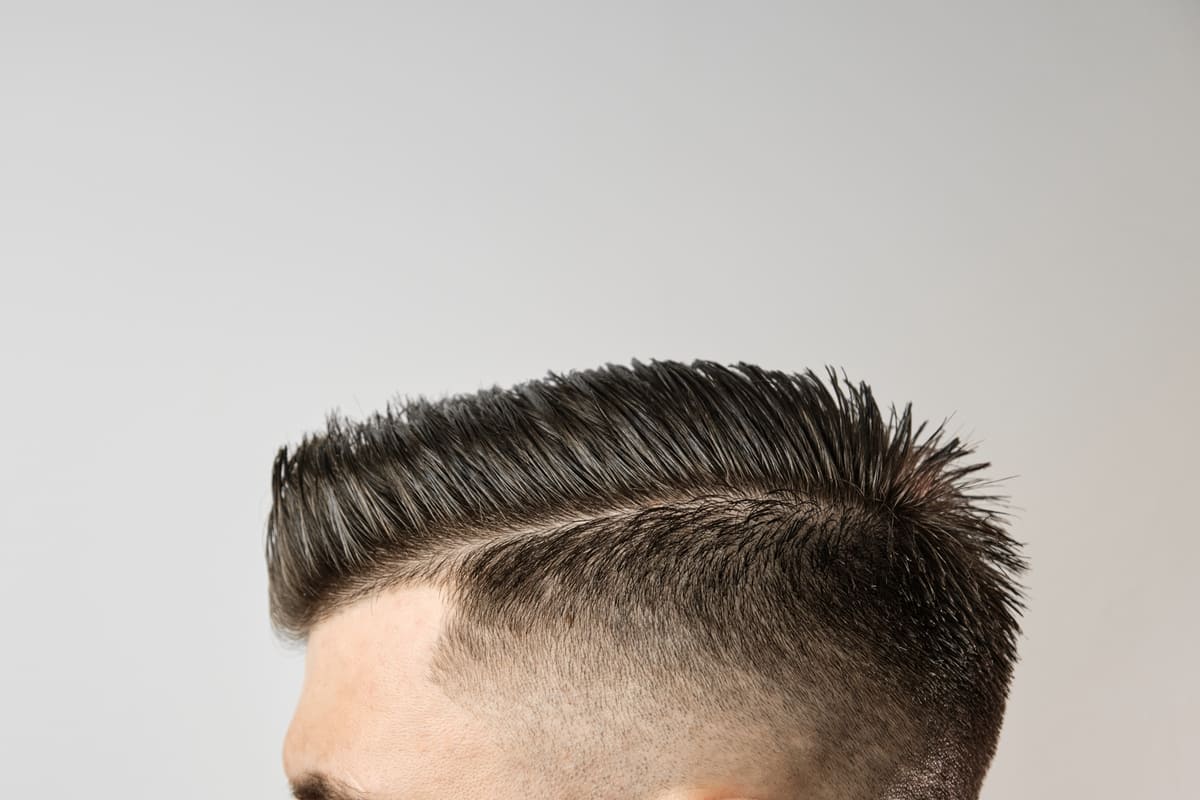 The wolf cut for men blends edgy layers and versatile texture, offering a bold, stylish, low-maintenance look.